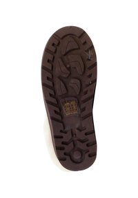 Bruine rubberen zool met een gestructureerd profiel. Heeft een verhoogd centraal gedeelte en gladde randen. Gele label met productdetails nabij de hiel.