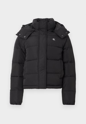 Black puffer jacket with high collar, detachable hood with snap buttons, and small white "CK" logo on the left chest.