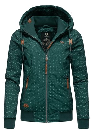 Dark green jacket with polka dot and zigzag pattern, featuring a hood, zip closure, brown leather accents, and elastic cuffs at the hem.