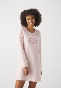 Long-sleeve nightdress in soft pink cotton with crew neck and embroidered heart design featuring the phrase "Enjoy the little things."