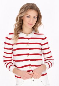 Red and white striped cardigan in soft knit, featuring round neckline and gold-tone buttons. Long sleeves and fitted design.