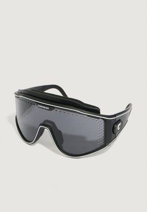 Black sporty goggles with dark lenses, featuring a padded inner lining, adjustable strap, and perforated detailing on the frame.