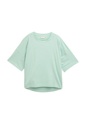 Miętowa luźna koszulka z krótkim rękawem, okrągłym dekoltem i zaokrąglonym dołem. Wykonana z miękkiego, gładkiego materiału.