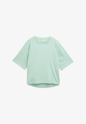 Miętowa luźna koszulka z krótkim rękawem, okrągłym dekoltem i zaokrąglonym dołem. Wykonana z miękkiego, gładkiego materiału.