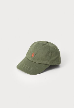 Green cotton baseball cap with a curved brim, featuring an embroidered red logo on the front and six ventilation eyelets.
