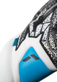 Gant avec un corps textile blanc, des accents noirs présentant un motif hexagonal et un détail en caoutchouc bleu. Design élégant avec une structure renforcée.