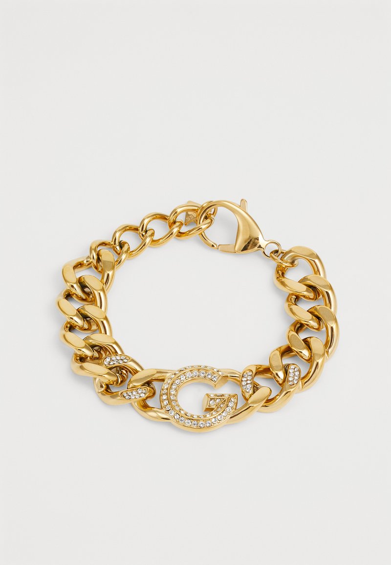 Gouden armband met grote schakels, een kreeftenhaak en een ronde accent met een "G" versierd met heldere strassstenen.