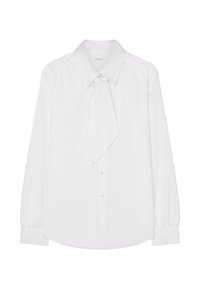 Vit skjorta med slipskrage, långa ärmar, knappstängning, mjukt tyg och lätt rynkning vid axlarna. Har rundad nederkant och knappar.