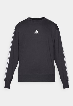Black long-sleeve sweatshirt featuring a white logo on the chest and white stripes along the sleeves. Made of soft fabric with a relaxed fit.
