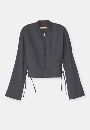 Gray cropped jacket with a high collar, front zipper, and long bell sleeves. Features side ties and a sleek textured fabric.