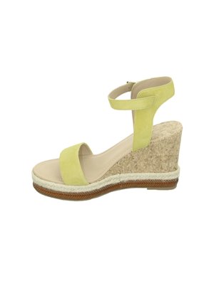 Green suede wedge sandal with a cork platform, featuring a wide toe strap and an ankle strap. Braided jute detail along the sole.