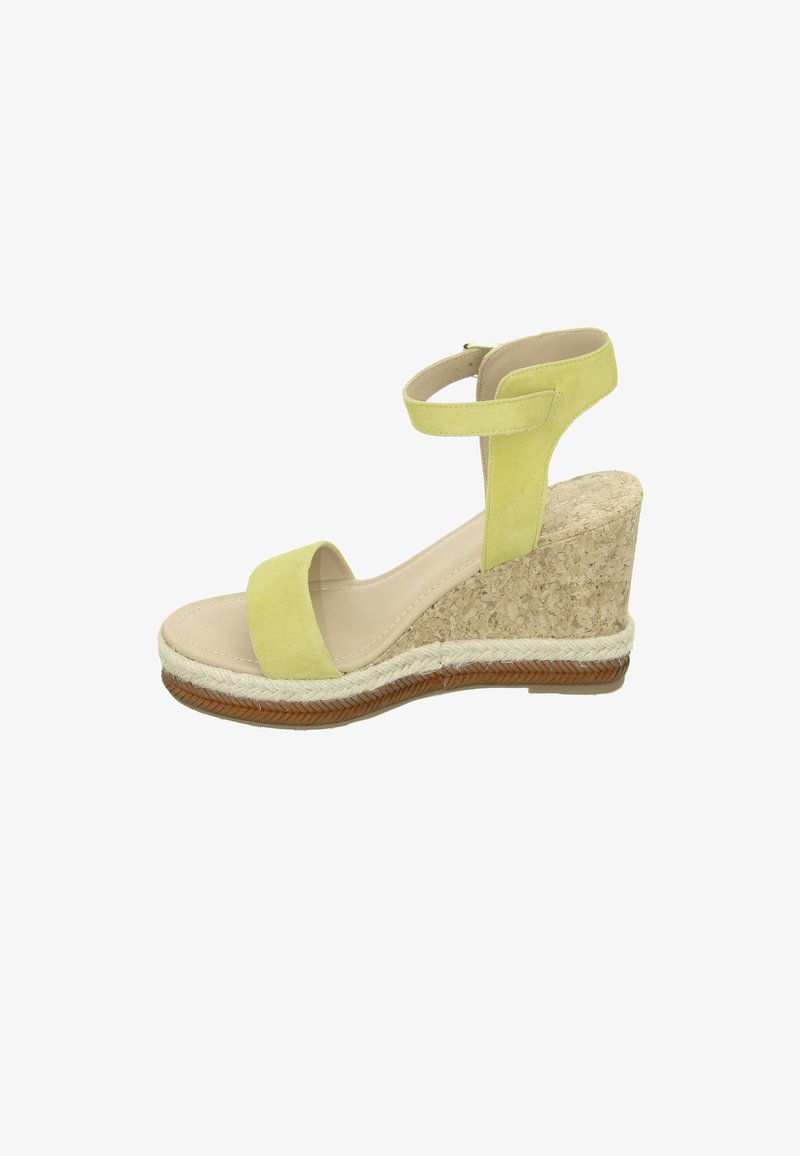 Green suede wedge sandal with a cork platform, featuring a wide toe strap and an ankle strap. Braided jute detail along the sole.