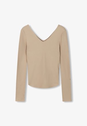 Long-sleeve, ribbed top in light beige with a V-neckline. Features a fitted design and smooth texture, suitable for layering.