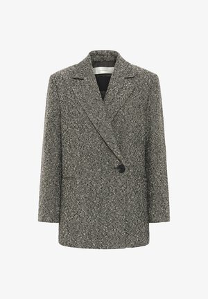 Dvoredni blazer iz teksturirane črne in bele tkanine. Ima velike reverje, en gumb za zapiranje in dve sprednji žepi.