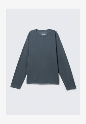 Langarm T-shirt met ronde hals in donker teal katoen, met een verlaagd schouderknip, een relaxte fit en zichtbare stikdetails.