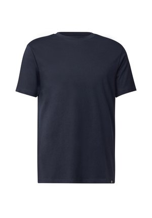 T-shirt à col rond à manches courtes, de couleur bleu marine uni, avec des détails de couture minimalistes et une petite étiquette en bas de l'ourlet.