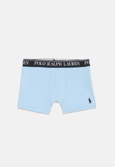 Šviesiai mėlyni medvilniniai apatiniai šortai su juodu elastingu juosmeniu, ant kurio užrašyta "POLO RALPH LAUREN", ir maža tamsiai mėlyna logo ant kairiojo šlaunies.