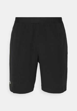 Czarne spodenki sportowe wykonane z lekkiego materiału, z elastycznym pasem i małym, wielokolorowym logo po lewej stronie u dołu.