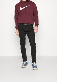 Tommy Jeans Jeans Tapered Fit - black denim