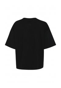 T-shirt oversized noir à manches courtes, col rond et logo texturé au dos. Tissu en coton doux avec une coupe décontractée.