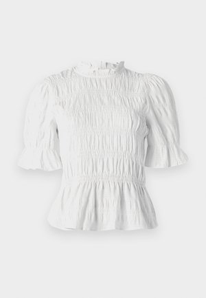 Baltas īsām piedurknēm blūze ar sakropļotu tekstūru, viļņotu apkakli un paplašinātām piedurknēm. Iezīmē pepluma apakšdaļu un elastīgu jostasvietu.