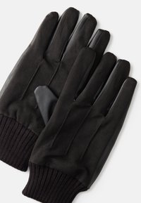 Gants noirs avec une finition en cuir lisse sur les doigts, un corps en tissu doux et des poignets en maille côtelée pour la chaleur et le confort.