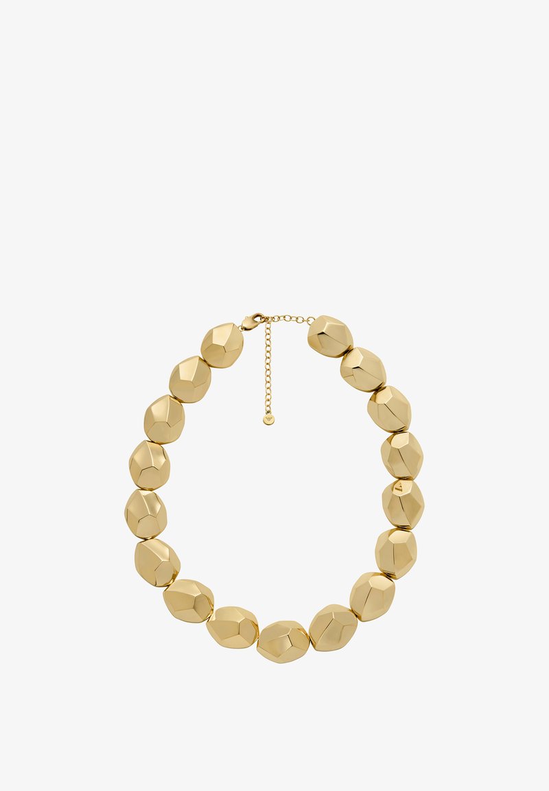 Zlatě tónovaný náhrdelník s fazetovanými, zaoblenými korálky uspořádanými v symetrickém vzoru. Nastavitelný řetízek s malou visačkou.