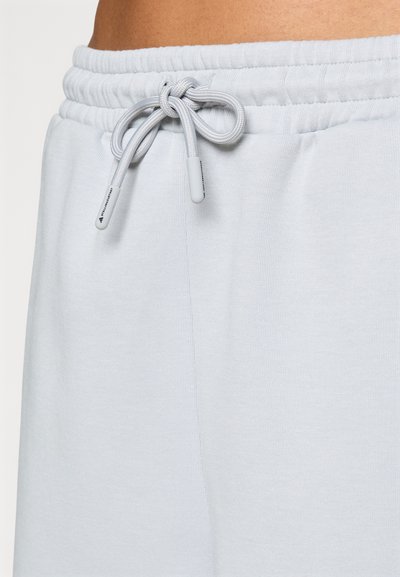 Light gray sweatpants with a ribbed waistband and a drawstring. The fabric appears soft with a smooth texture. No visible patterns or accents.
