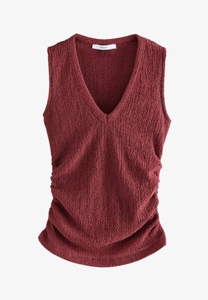 Czerwony top bez rękawów z dekoltem w kształcie litery V, wykonany z teksturowanej tkaniny z marszczonymi bokami tworzącymi delikatny efekt drapowania. Na metce napis "NEXT".