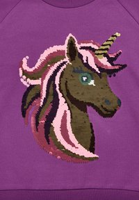 Purple sweatshirt featuring a sequin unicorn design in brown, pink, and green with a spiraled golden horn and textured hair accents.