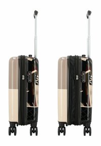 Valigia rigida in beige e nero, con un esterno resistente, manico telescopico e quattro ruote che scorrono senza sforzo. Chiusura con zip e lucchetto.