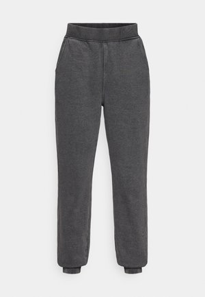 Pantaloni da jogging grigi in misto cotone con elastico in vita, due tasche laterali e polsini affusolati. Texture liscia, design semplice.