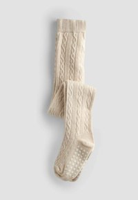 Beige trikotāžas stulpiņi ar faktūru un silikona pretslīdes punktiņiem uz zolēm labākai saķerei. Mīksts, adīts audums.