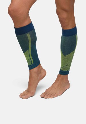 Kompressionsbeinsleeves in Marineblau und Grün. Strickgewebe mit strukturierten Mustern, gerippten Bündchen und einem konturierten Design für einen ergonomischen Sitz.