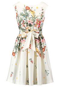 Blommig klänning med åtsittande överdel, vit tyg, färgglada blommönster, figursydd midja och en rosett framtill. A-linjeformad silhuett.