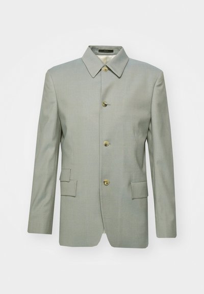 Light grey blazer made of smooth fabric, featuring a classic collar, four gold buttons, and two front pockets. Tailored, structured silhouette.