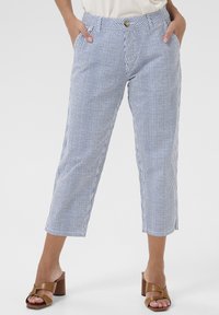 Blue and white striped cropped pants with a fitted waist, front pockets, and a gold button closure, made from lightweight fabric.