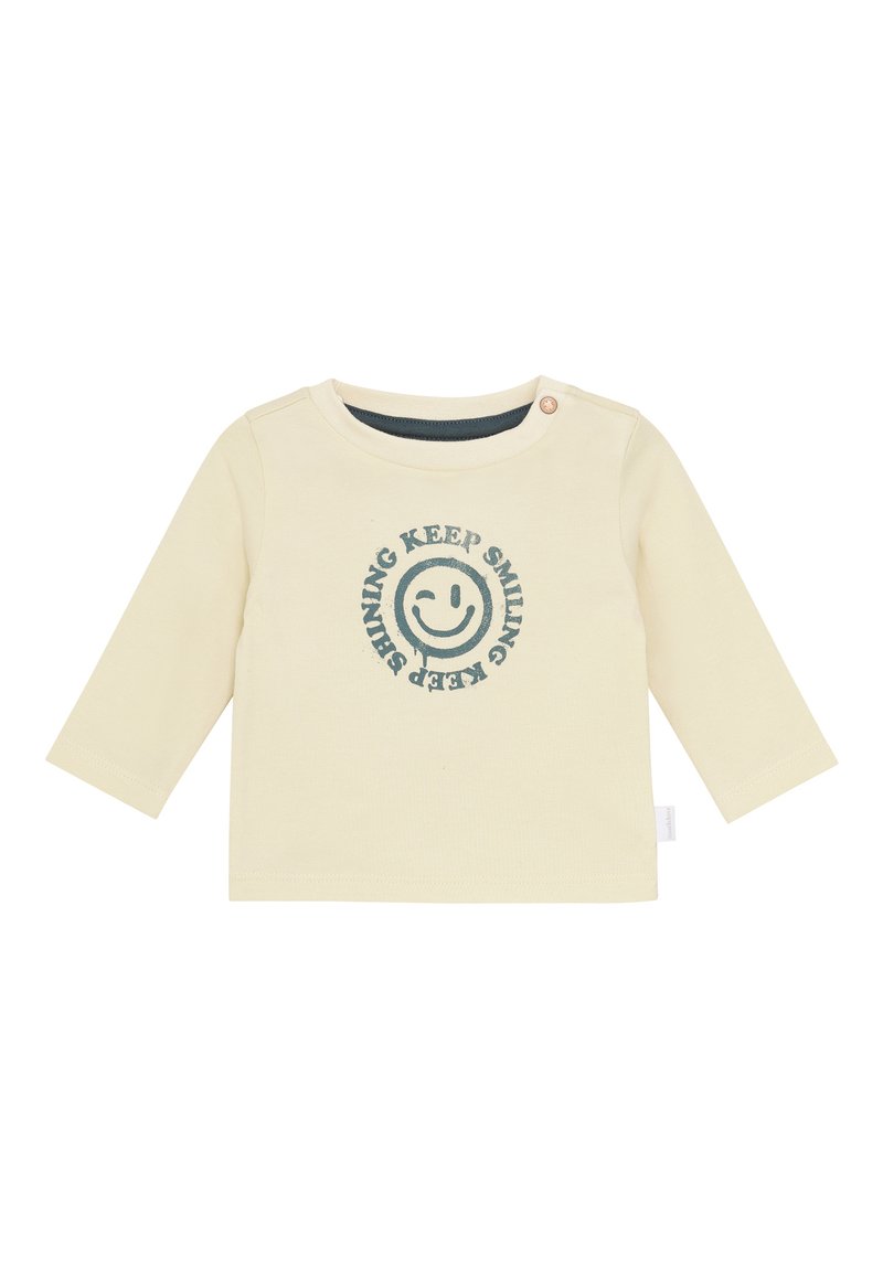 Hellebärige Langarm-Babyshirt mit Knopf an der Schulter und blauer Smiley-Gesicht-Grafik mit dem Text "HALTE DAS LÄCHELN, HALTE DAS STRAHLEN".