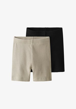 Ensemble de deux shorts côtelés, l'un en beige clair et l'autre en noir. Caractérisés par une taille élastique et un tissu doux et texturé.