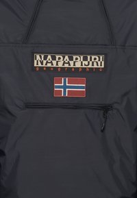 Navy pullover jacket featuring a prominent logo patch and a Norwegian flag patch. Material appears water-resistant with a smooth, matte texture.