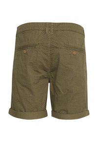 Olive green men's shorts with small black diamond pattern, rolled cuffs, back welt pockets, and wooden button closures.