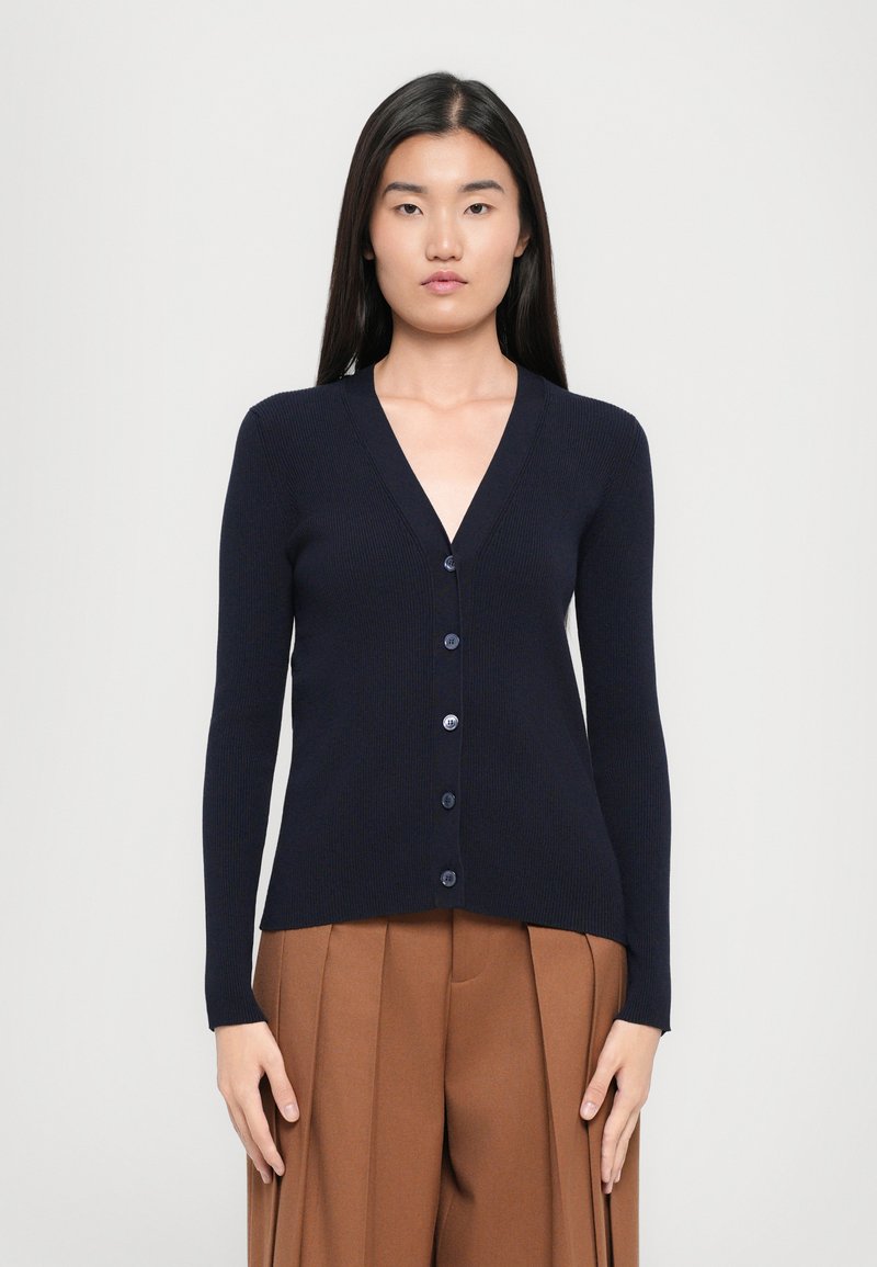 Navy ribbed cardigan with a V-neck, long sleeves, and front button closure. Features a fitted silhouette and smooth texture.