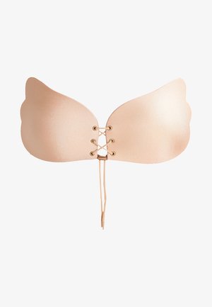 Bežs līmējošs krūšturis ar gludu tekstūru, kuram ir spārnu dizains un zelta aksesuāri laces. Regulējamas siksnas izmēra pielāgošanai.