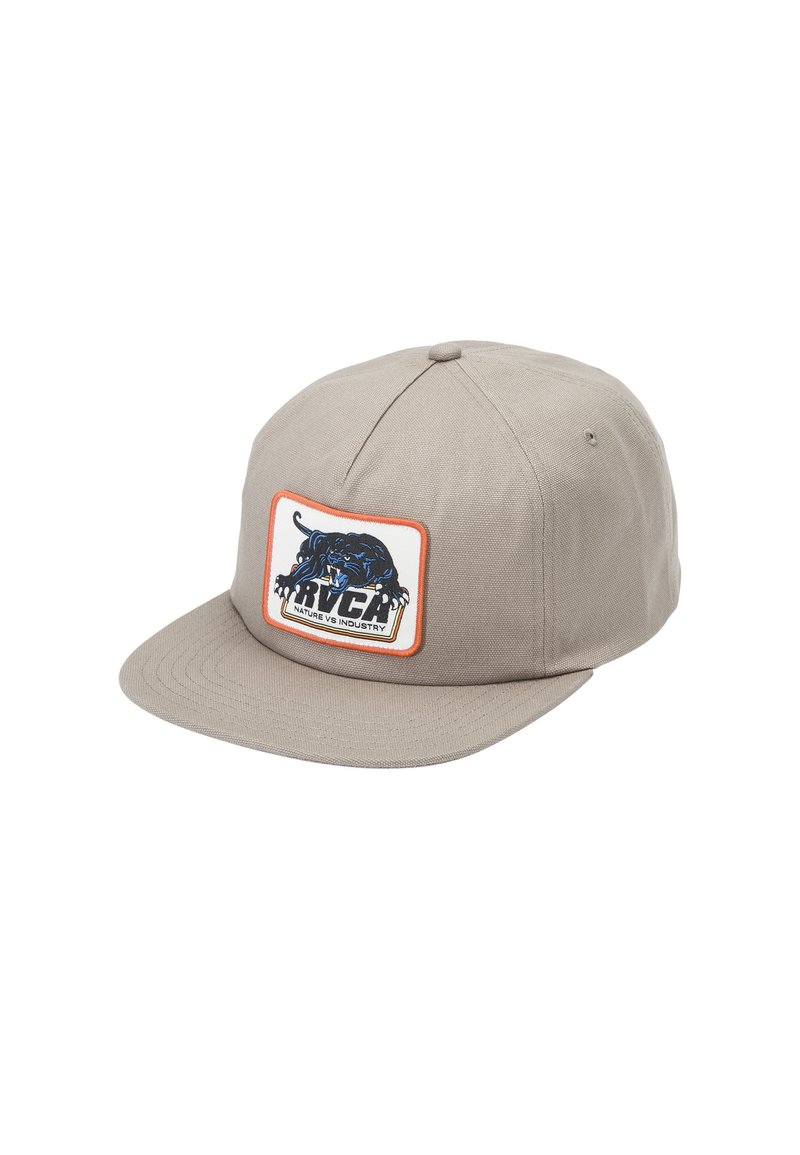 Beige cap made of textured fabric, featuring a rectangular patch with a blue animal graphic and bold black text. Visor is flat and wide.