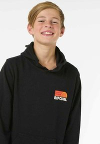 Sweatshirt à capuche noire en mélange de coton, avec une poche frontale et un logo « Ripcurl » coloré avec des rayures horizontales et un détail de soleil.