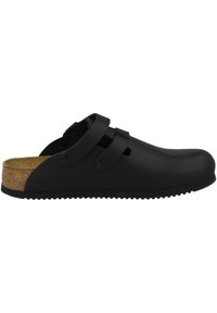 Schwarze Clogs aus synthetischem Material mit einem Kork-Fußbett. Verfügt über zwei dekorative Riemen und kreisförmige Verschlüsse. Gummisohle mit strukturiertem Grip.