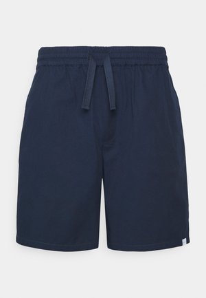 Shorts bleu marine en matière légère, dotés d'une taille élastique avec cordon de serrage et de poches latérales. Texture lisse avec un minimum de détails.
