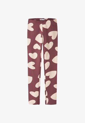 Leggings marron avec de grands motifs de cœur beige, taille élastique et jambes longues.