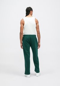 Ellesse PAULLO - Tepláky - dark green