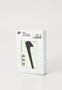 Nike Air Max 90 Card Wallet in light green leather with black accents. Features integrated card slots and a signature logo design.